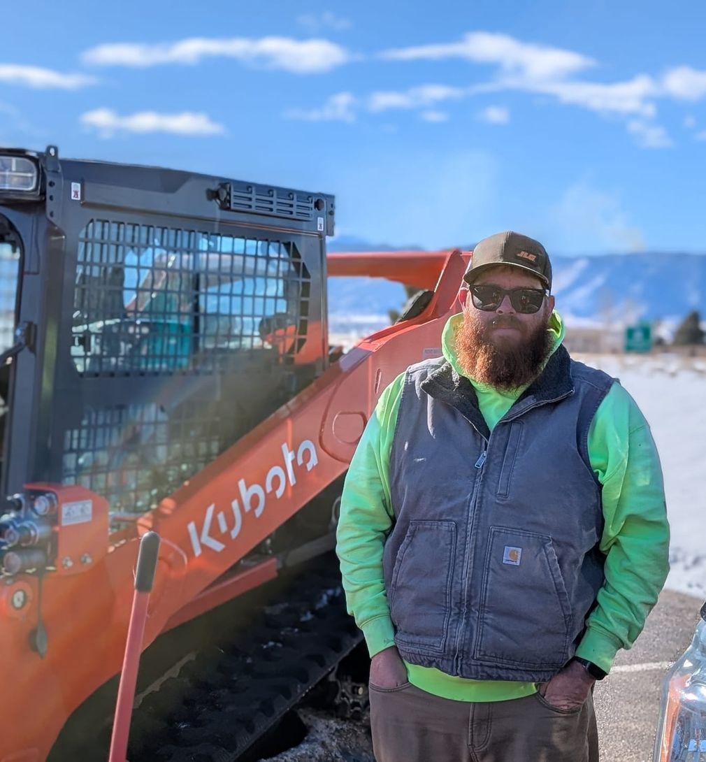 Al Mason beside the Kubota track loader