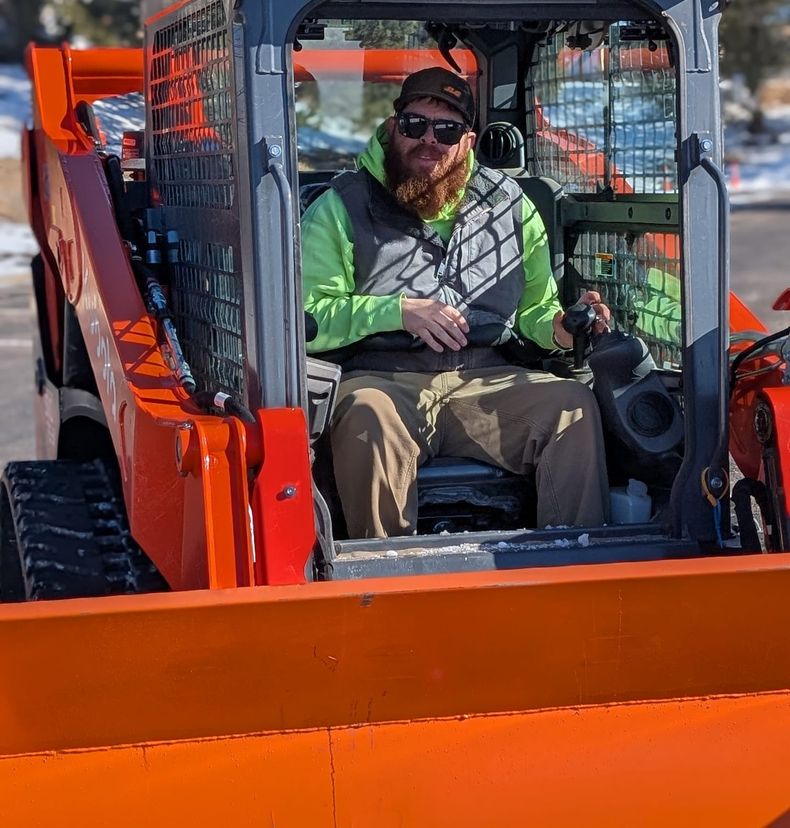 Al Mason in the cab of the Kubota loader