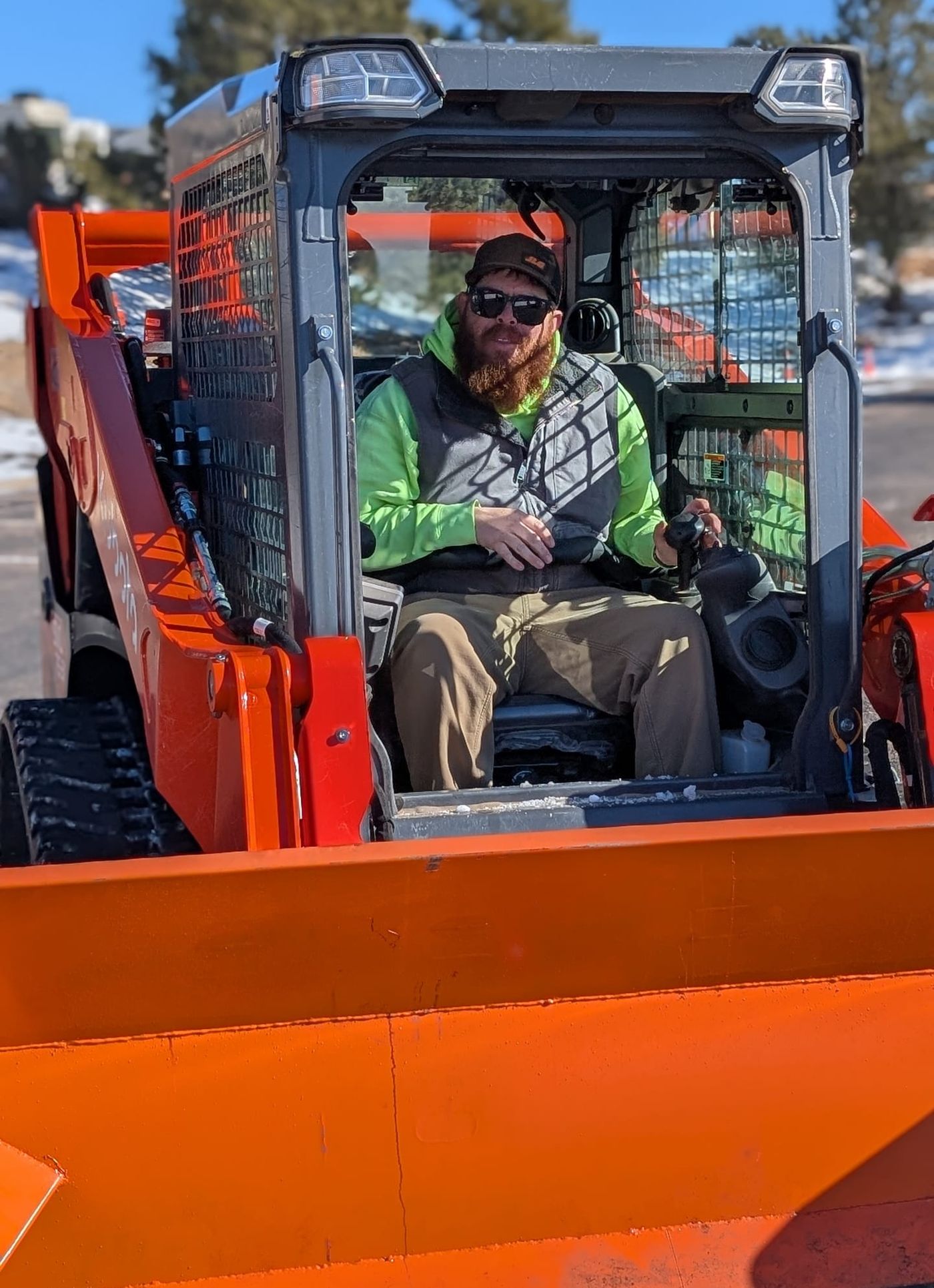 Al Mason at the controls of the Kubota loader